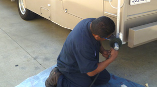 technician working on motorhome from www.thecrashdoctor.com