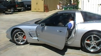 2001 corvette customer in car after repair and paint job from www.autobodyunlimitedinc.com photo